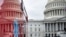 A view of the Capitol's Rotunda is seen reflected in an ambulance on Capitol Hill in Washington, March 24, 2020.