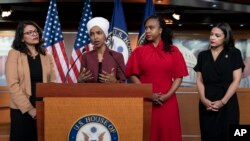 From left, U.S. Reps. Rashida Tlaib, Ilhan Omar, Ayanna Pressley and Alexandria Ocasio-Cortez respond to base remarks by President Donald Trump, at the Capitol in Washington, July 15, 2019. Tuesday, the House voted to condemn Trump for his comments.